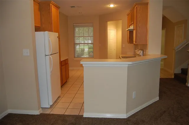 a view of a kitchen with electric appliances