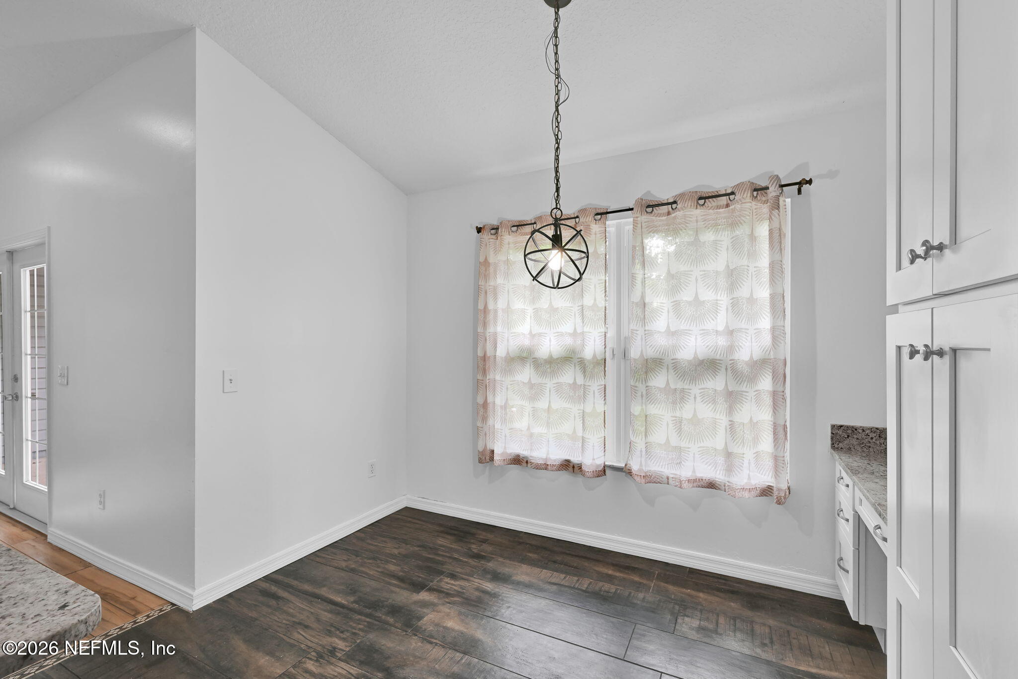 1110 Woodlawn Road, Unit D St. Augustine, FL 32084 - Photo 21 of 40 a view of an empty room with a window