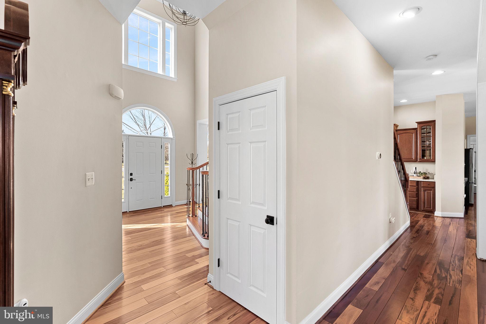 38590 Bettis Drive Hamilton, VA 20158 - Photo 18 of 97 a view of a hallway with wooden floor and a living room