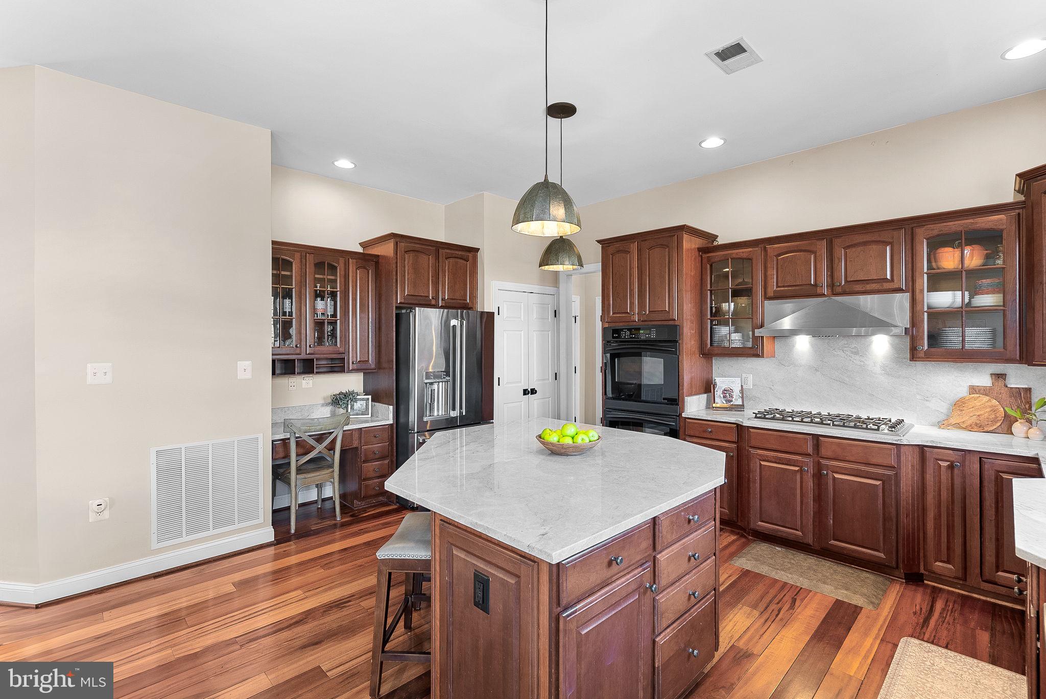 38590 Bettis Drive Hamilton, VA 20158 - Photo 34 of 97 a kitchen with stainless steel appliances granite countertop a sink stove and refrigerator