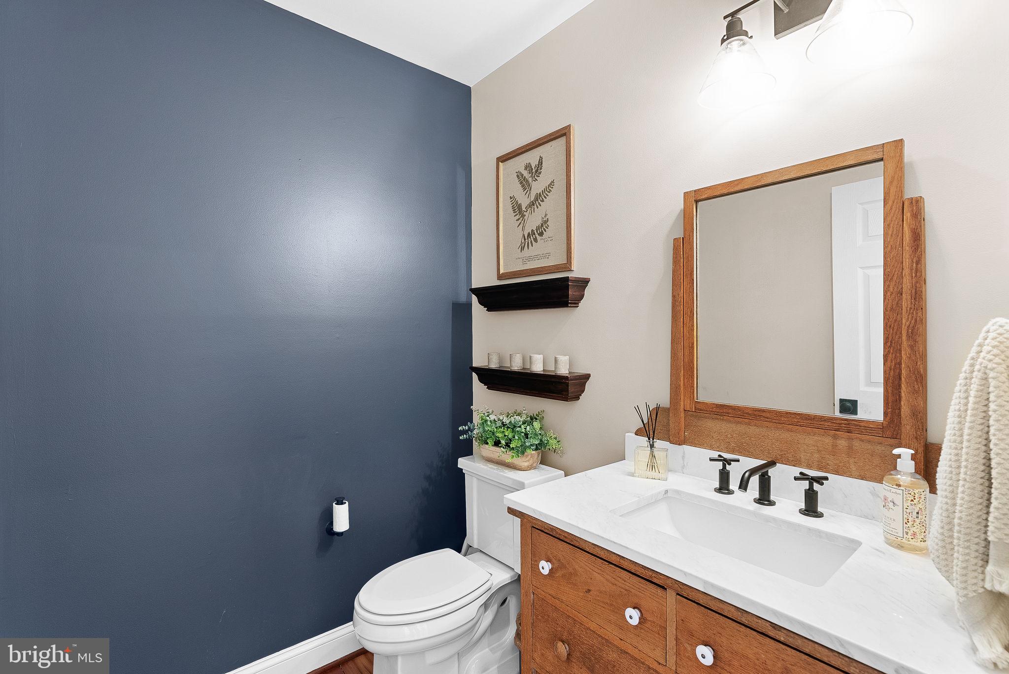 38590 Bettis Drive Hamilton, VA 20158 - Photo 40 of 97 a bathroom with a granite countertop toilet a sink and mirror