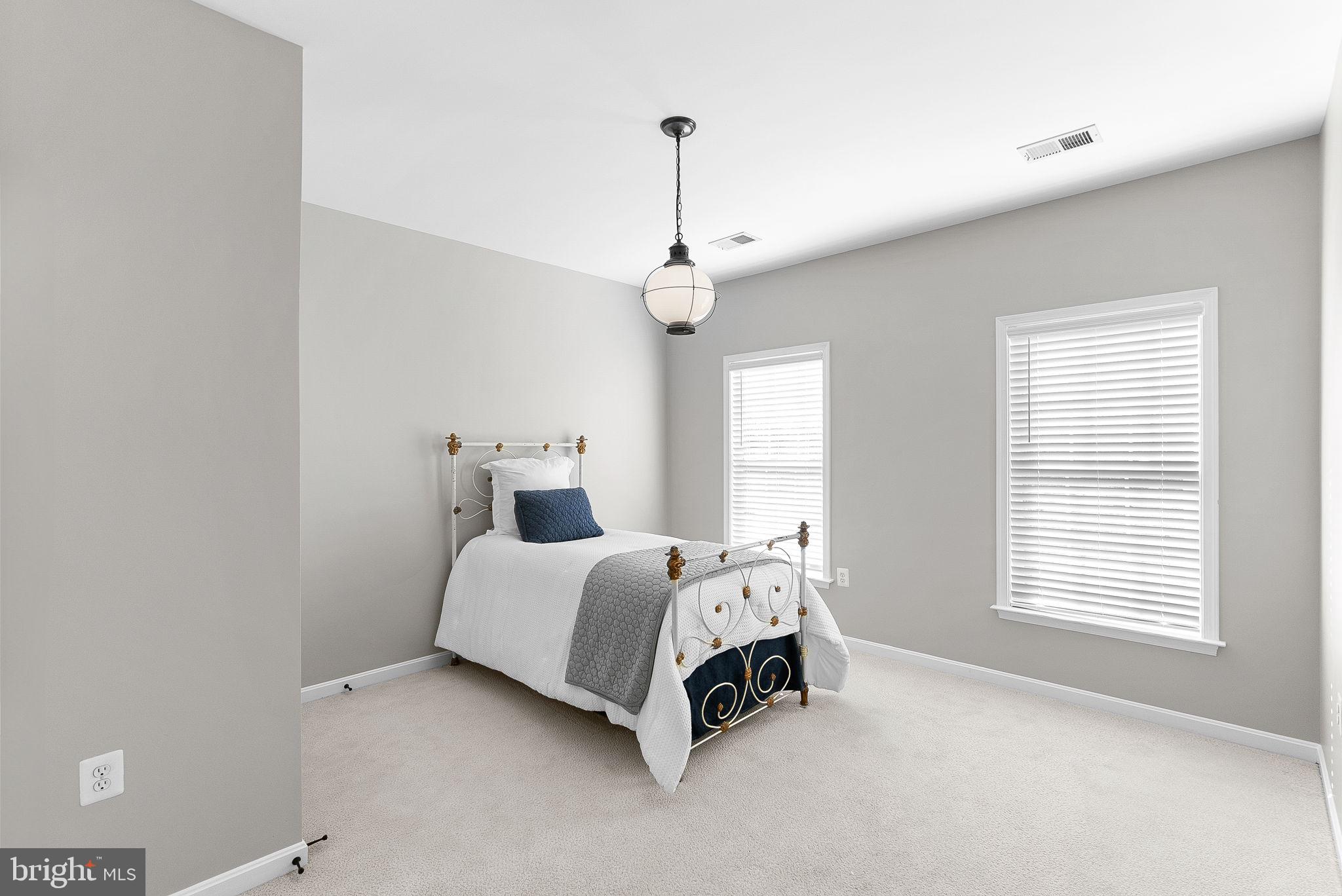 38590 Bettis Drive Hamilton, VA 20158 - Photo 61 of 97 a spacious bedroom with a bed and a window