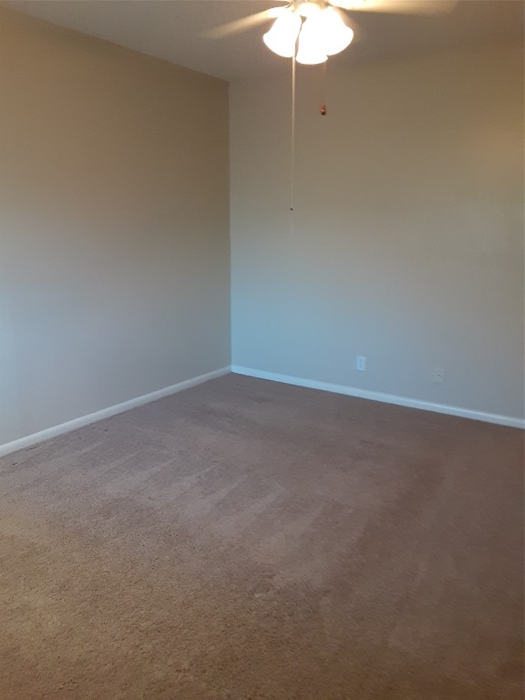 3206 Mossrock Drive, Unit 101 Austin, TX 78757 - Photo 14 of 21 a view of an empty room with a fan
