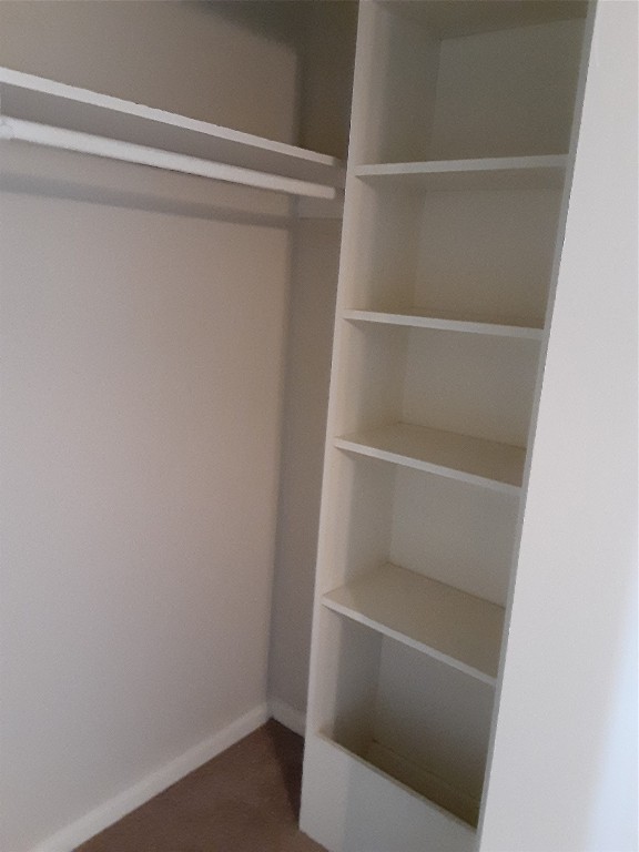 3206 Mossrock Drive, Unit 101 Austin, TX 78757 - Photo 16 of 21 a view of walk in closet with empty racks