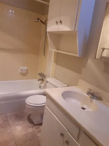 a bathroom with a sink a toilet and a bathtub