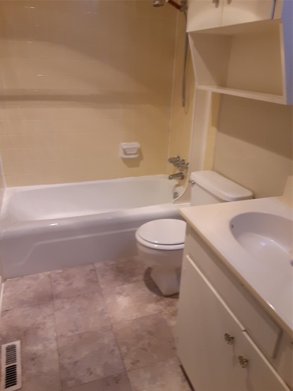 3206 Mossrock Drive, Unit 101 Austin, TX 78757 - Photo 18 of 21 a bathroom with a sink a toilet and a bathtub