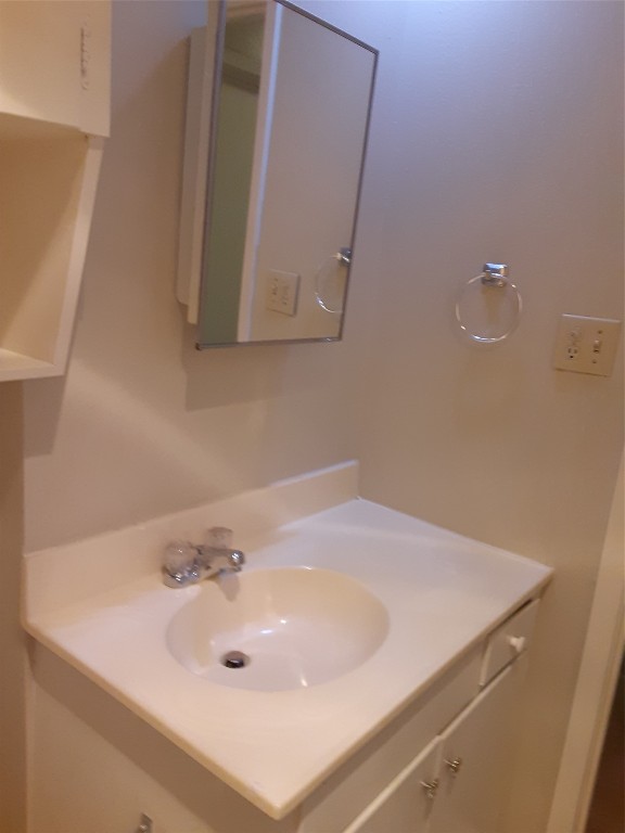 3206 Mossrock Drive, Unit 101 Austin, TX 78757 - Photo 19 of 21 a bathroom with a sink and a mirror