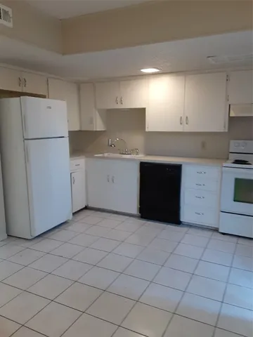 a kitchen with a cabinets