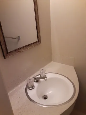 a white toilet sitting next to a shower