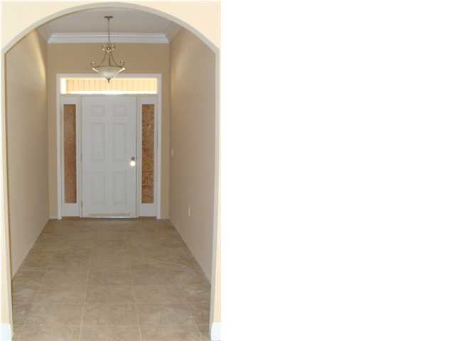 614 Lang Road Fort Walton Beach, FL 32547 - Photo 2 of 7 a view of a hallway with a chandelier