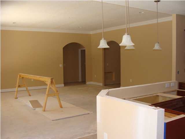 614 Lang Road Fort Walton Beach, FL 32547 - Photo 3 of 7 a kitchen with a table and a chandelier