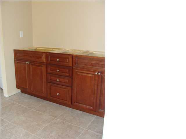 614 Lang Road Fort Walton Beach, FL 32547 - Photo 7 of 7 a room with a dresser and a mirror