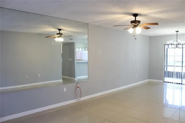 a view of kitchen with refrigerator and stove