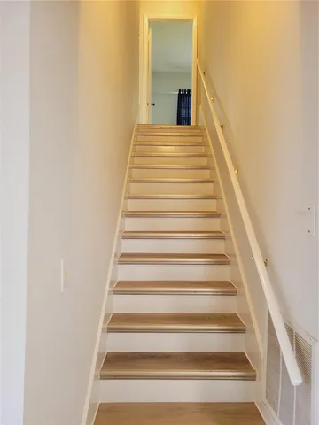 a white toilet sitting next to a bath tub and shower