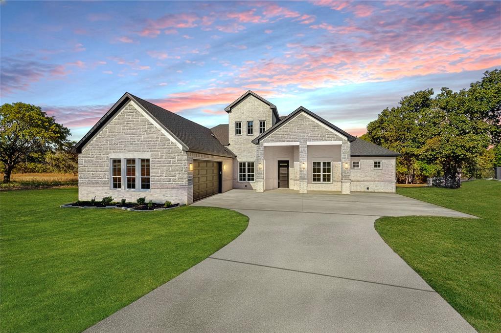 1161 Gonzollas Road Springtown, TX 76082 - Photo 2 of 40 a front view of house with yard and green space