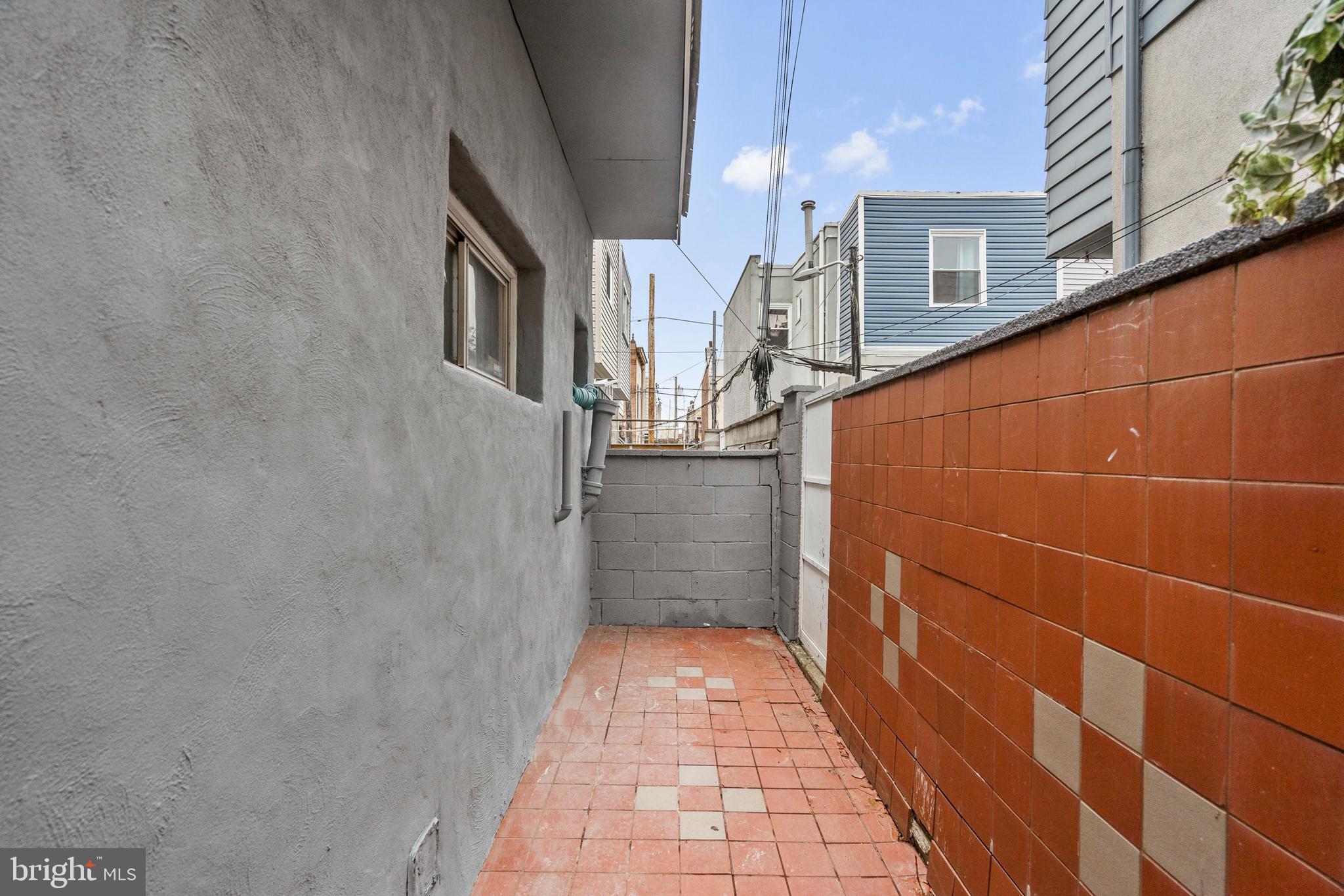 1605 Wolf Street Philadelphia, PA 19145 - Photo 16 of 40 a view of a pathway along a building