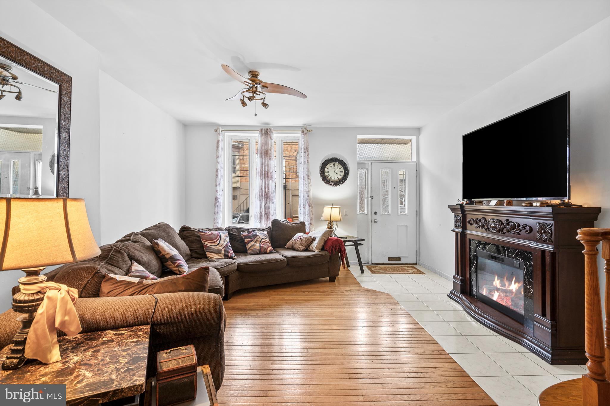 1605 Wolf Street Philadelphia, PA 19145 - Photo 19 of 40 a living room with furniture and a flat screen tv
