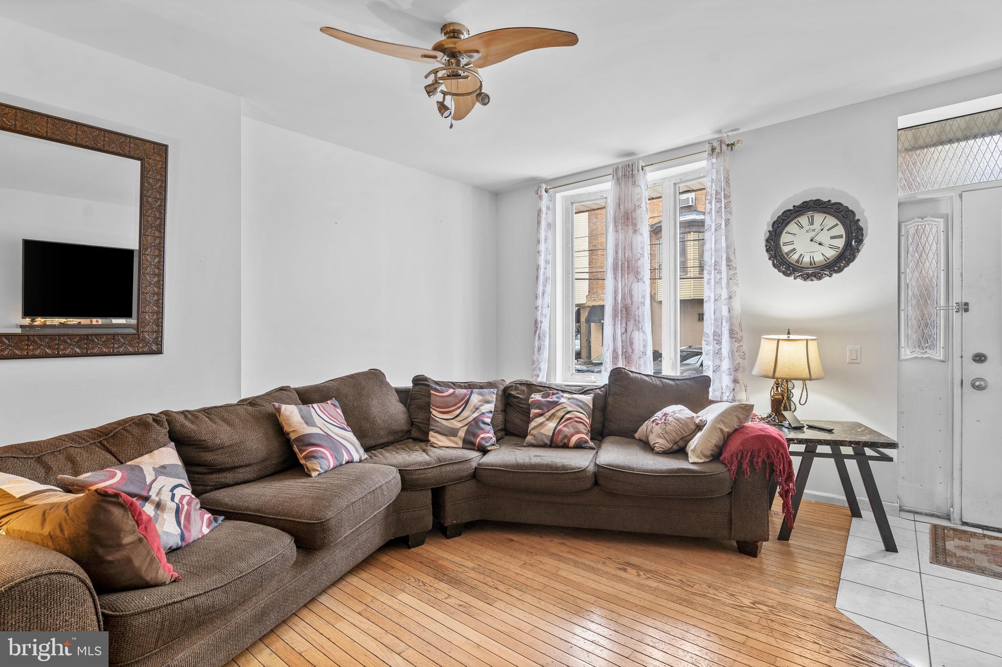 1605 Wolf Street Philadelphia, PA 19145 - Photo 20 of 40 a living room with furniture and a large window