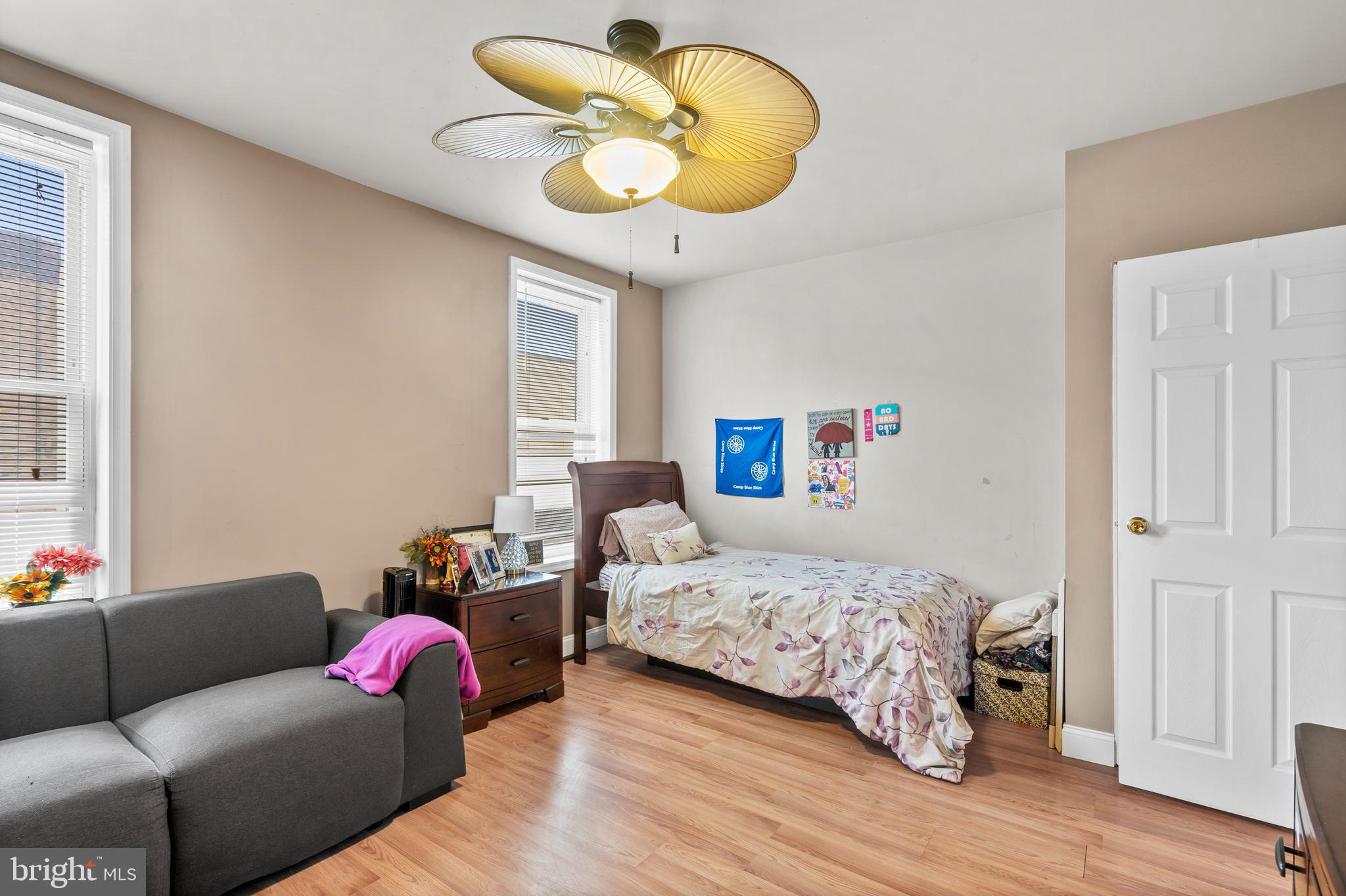 1605 Wolf Street Philadelphia, PA 19145 - Photo 23 of 40 a bedroom with bed and a chandelier