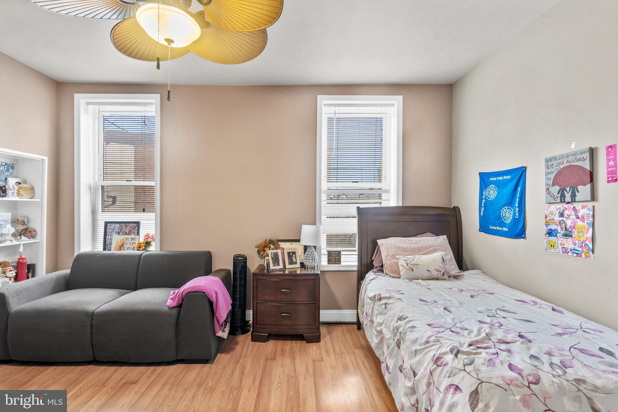 1605 Wolf Street Philadelphia, PA 19145 - Photo 24 of 40 a bedroom with a bed and wooden floor