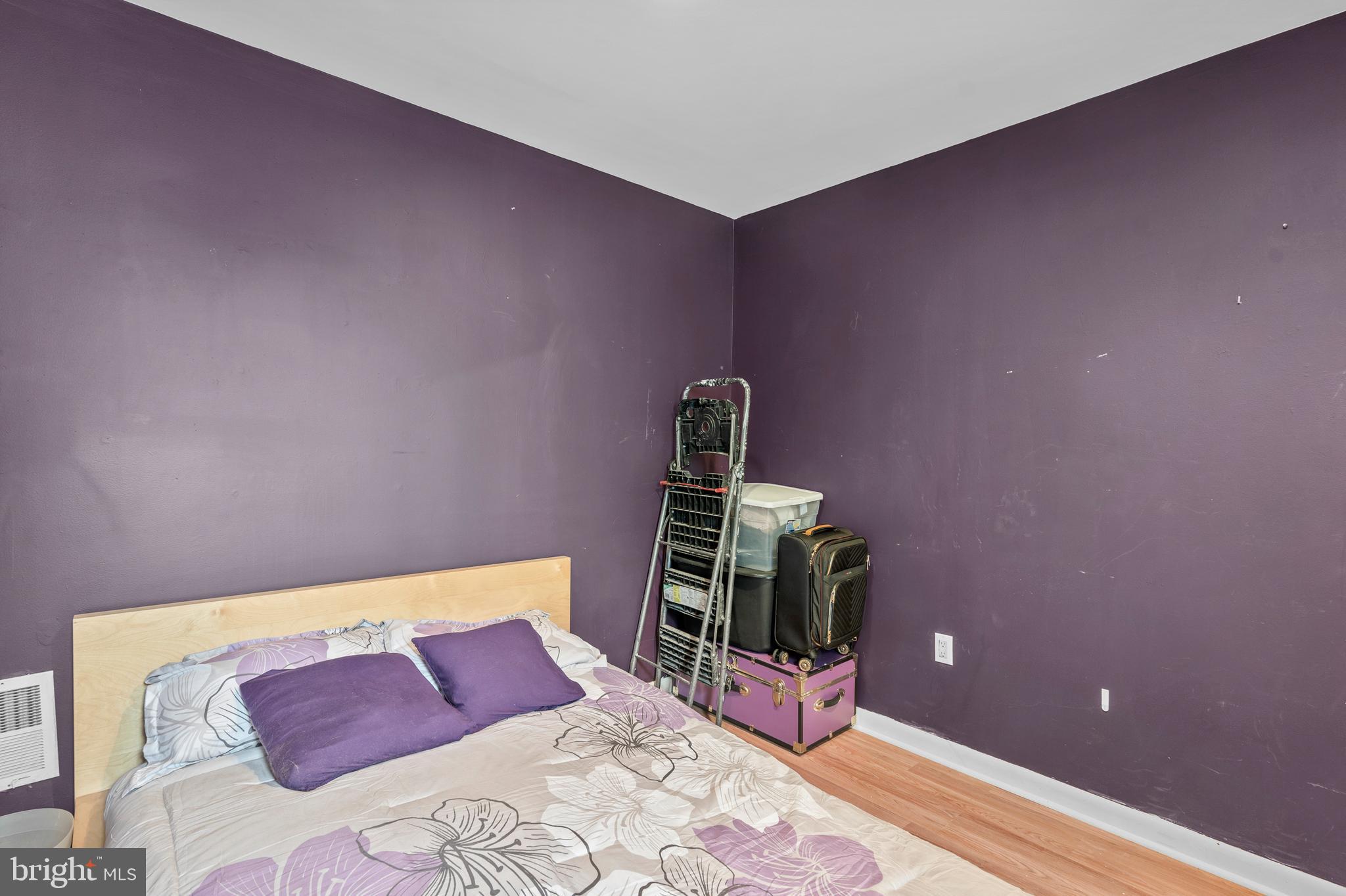 1605 Wolf Street Philadelphia, PA 19145 - Photo 33 of 40 a bedroom with a bed and wooden floor