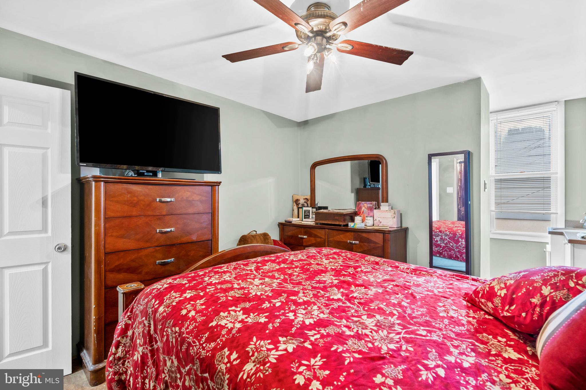 1605 Wolf Street Philadelphia, PA 19145 - Photo 36 of 40 a bedroom with a bed and a flat screen tv