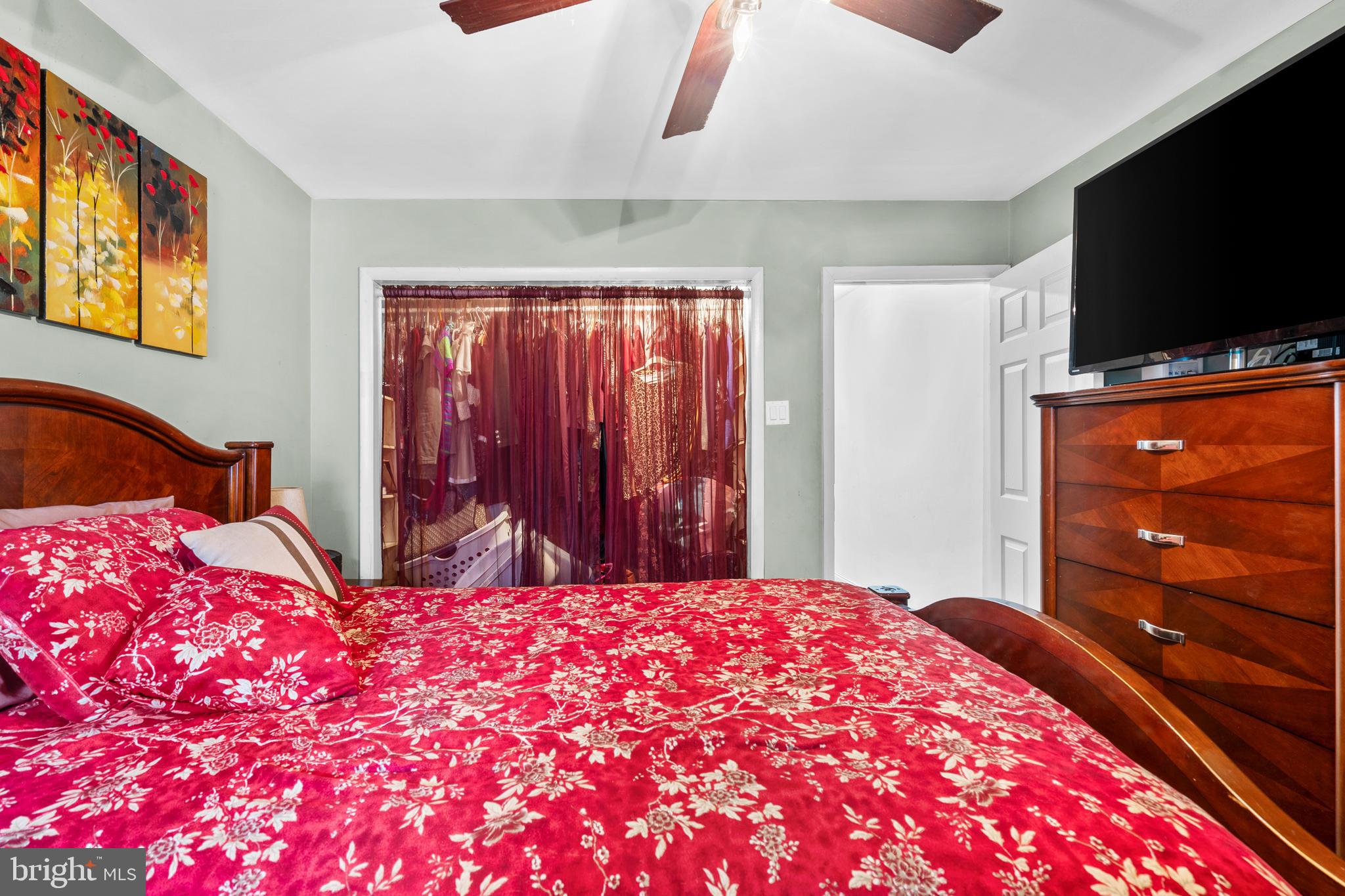 1605 Wolf Street Philadelphia, PA 19145 - Photo 37 of 40 a bedroom with a bed and a flat screen tv