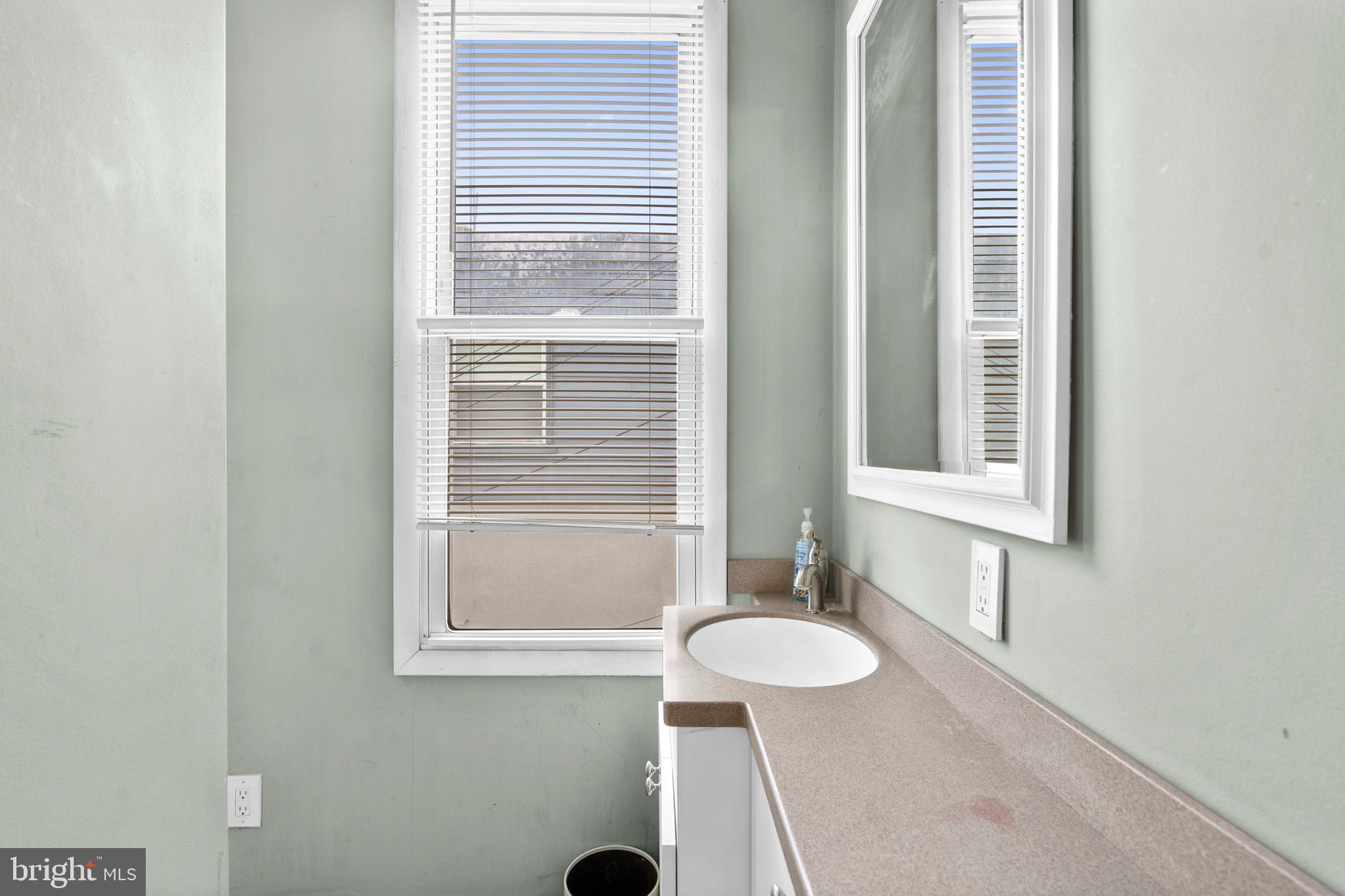 1605 Wolf Street Philadelphia, PA 19145 - Photo 38 of 40 a bathroom with a sink and a vanity