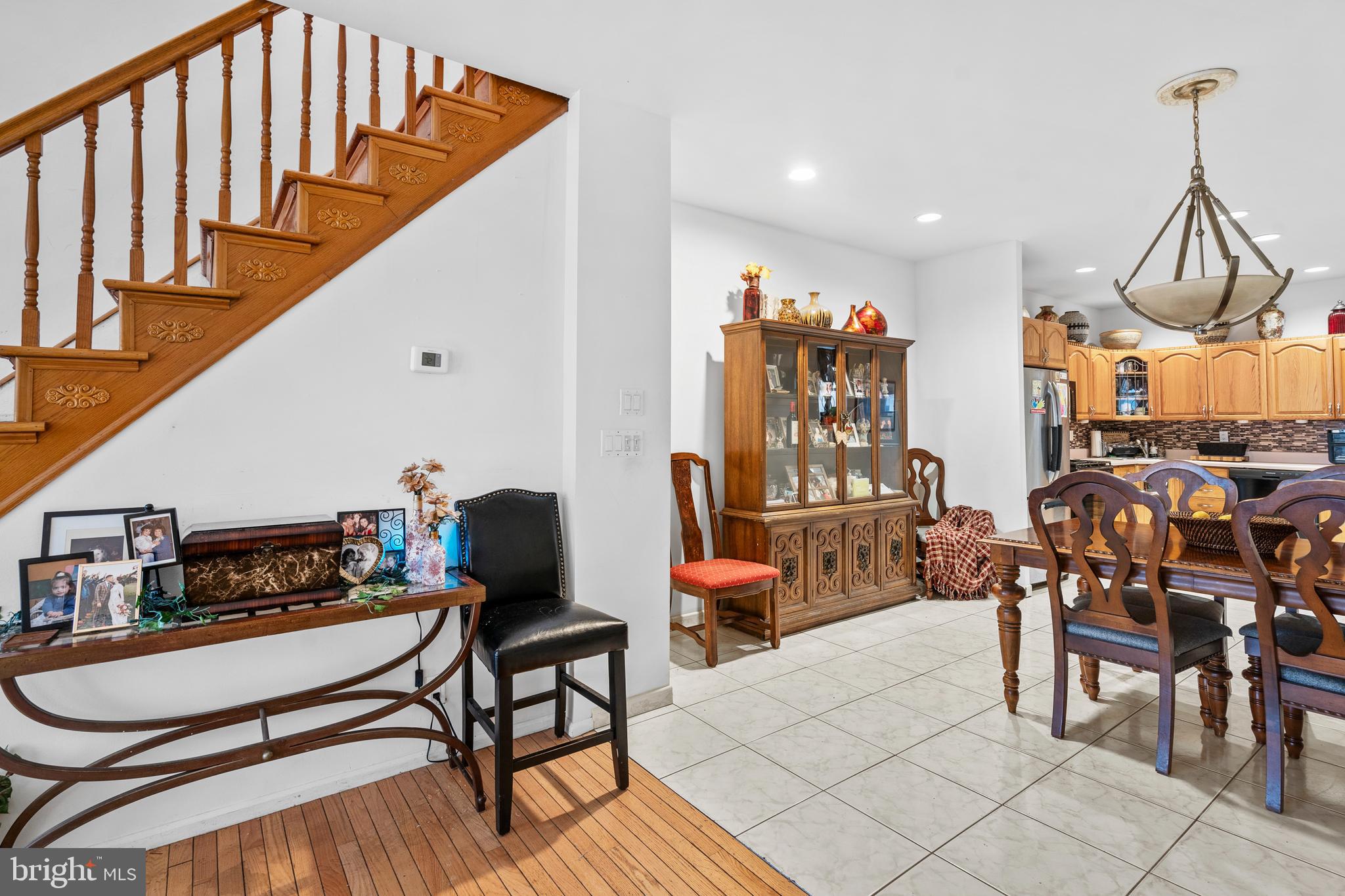 1605 Wolf Street Philadelphia, PA 19145 - Photo 7 of 40 a living room with furniture a rug and a chandelier