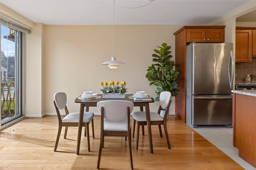 1400 East Avenue, Unit UN307 Rochester, NY 14610 - Photo 13 of 47 Dining area and slider to balcony