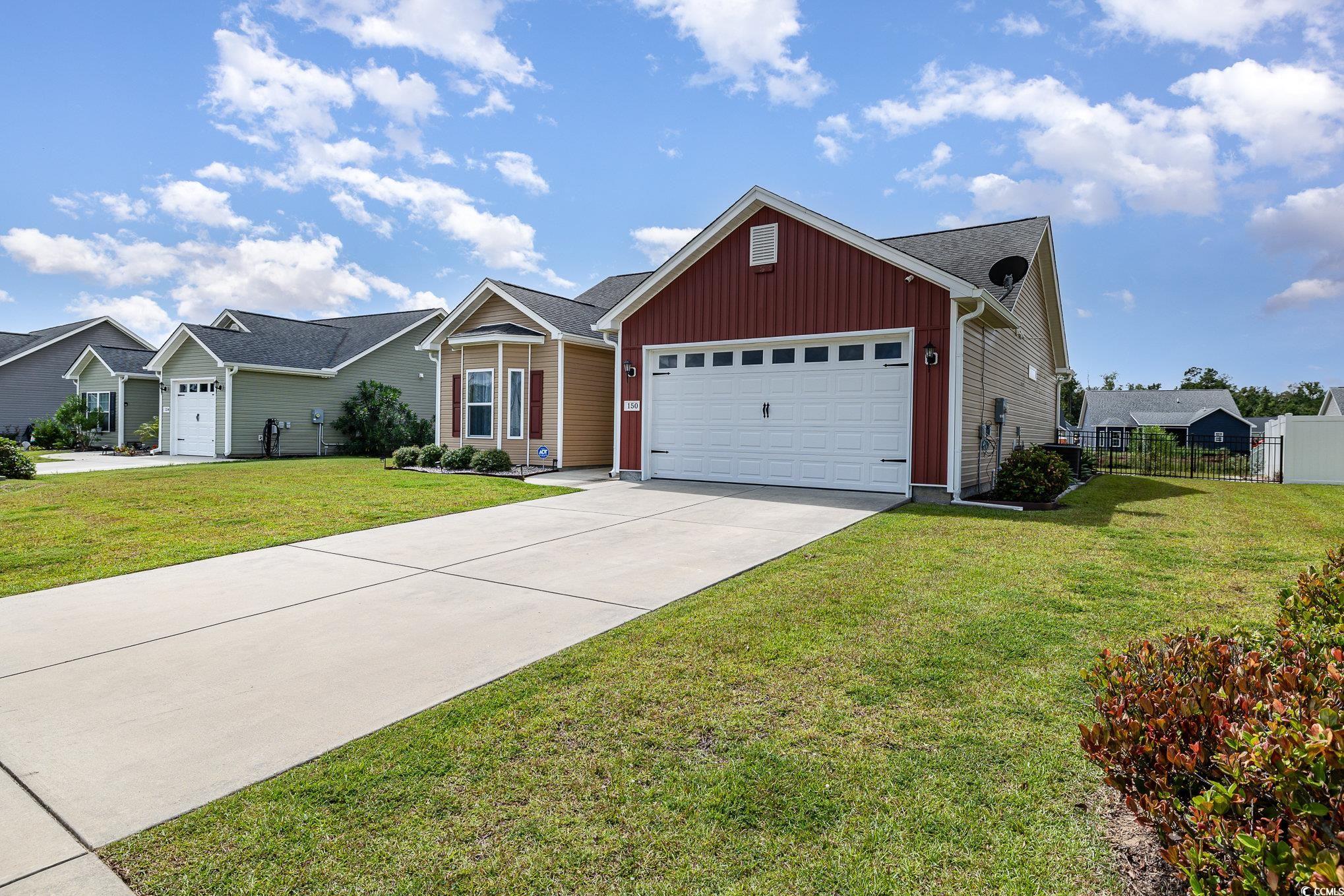 150 Springtide Drive Conway, SC 29527 - Photo 31 of 36 Ranch-style house featuring a front yard and a gar