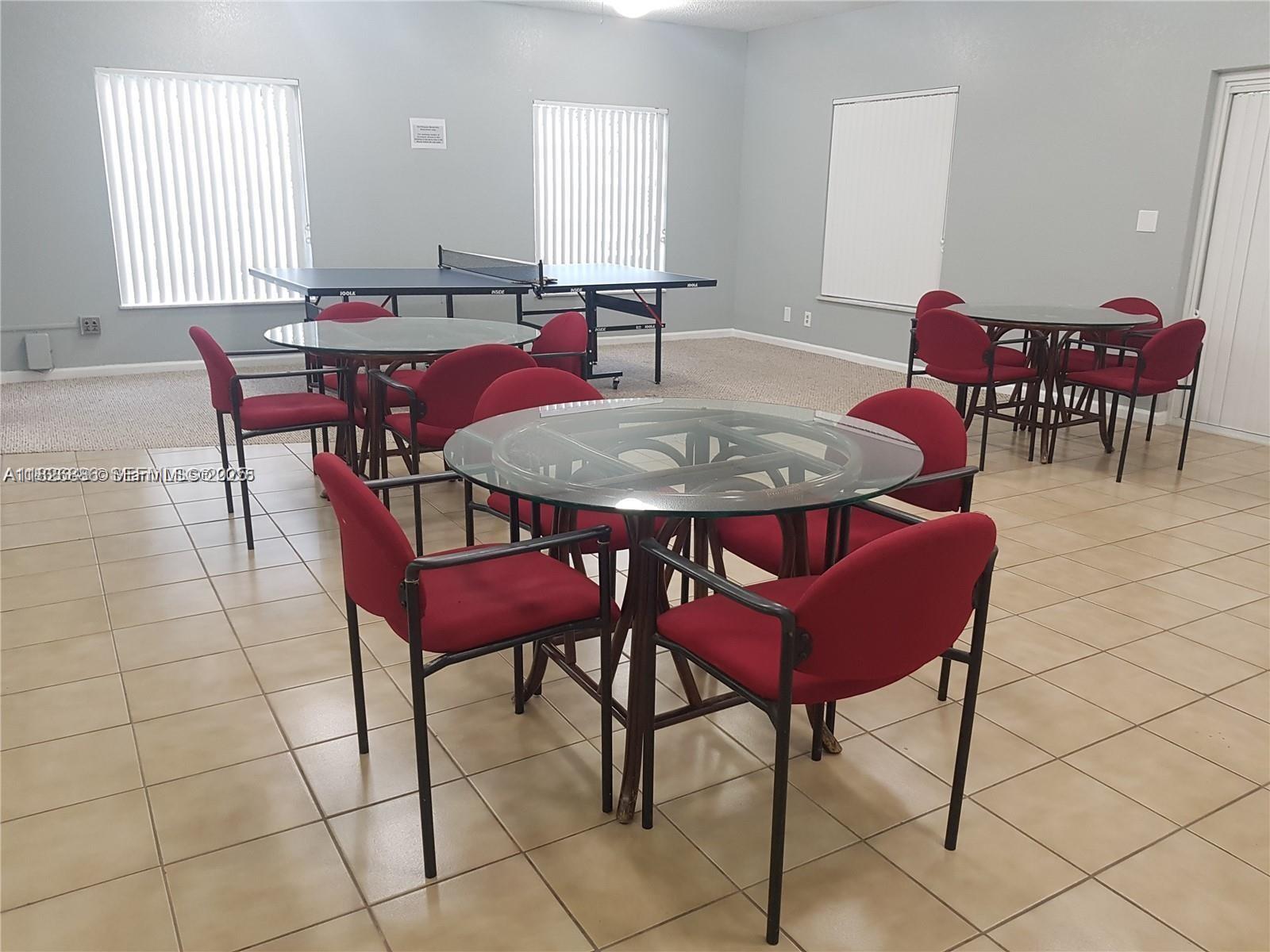 253 South Cypress Road, Unit 237 Pompano Beach, FL 33060 - Photo 23 of 23 a view of a dining room with furniture