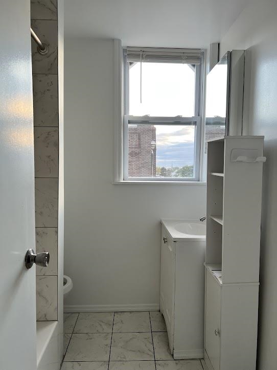 1201 John F. Kennedy Boulevard, Unit 4 North Bergen, NJ 07047 - Photo 4 of 13 a bathroom with a granite countertop sink toilet and shower