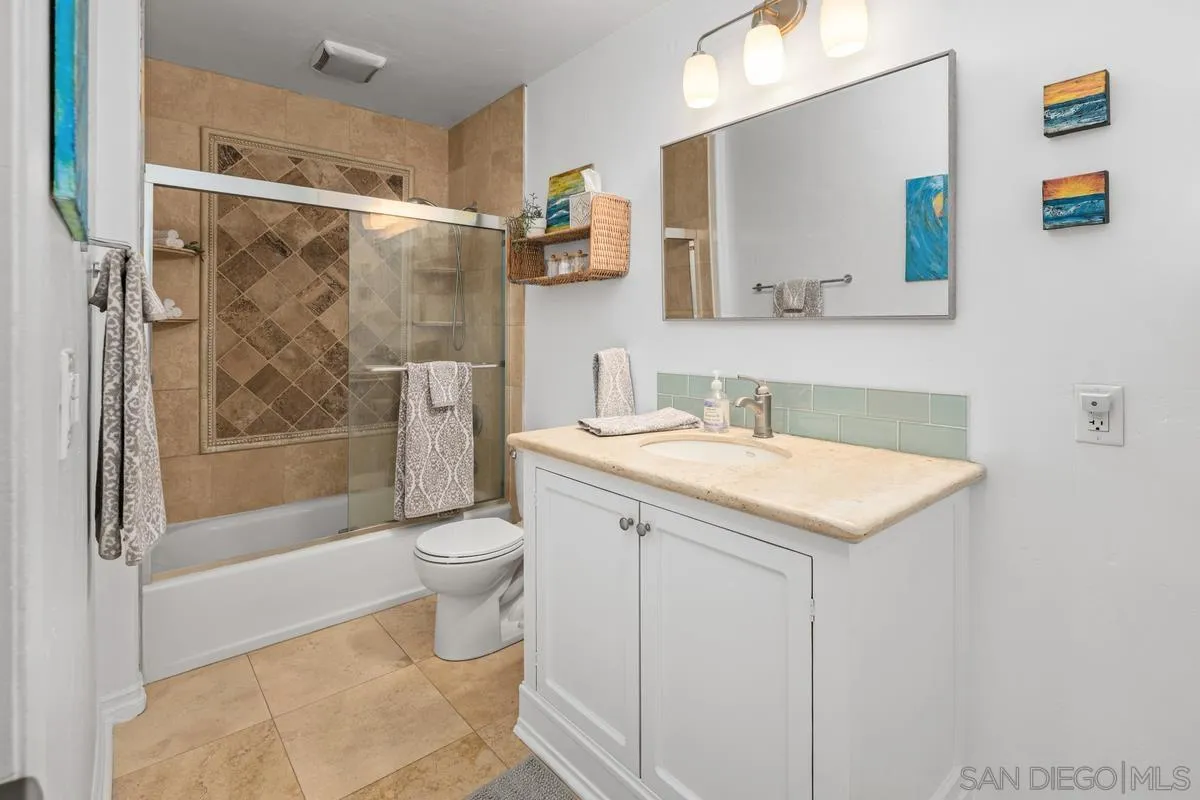 5946 Rancho Mission Road, Unit 160 San Diego, CA 92108 - Photo 15 of 31 a bathroom with a sink a toilet and shower