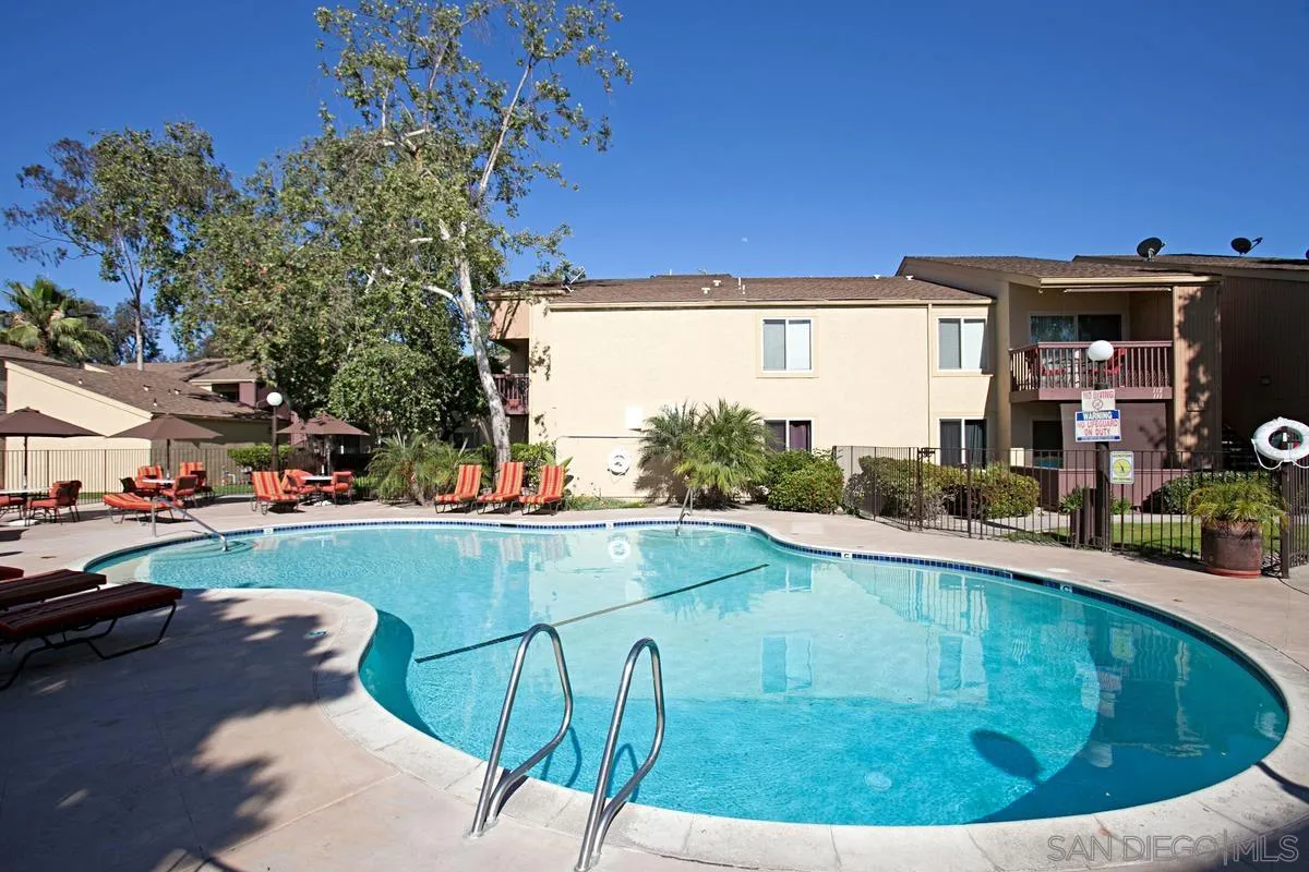 5946 Rancho Mission Road, Unit 160 San Diego, CA 92108 - Photo 21 of 31 a view of swimming pool from a lounge chair
