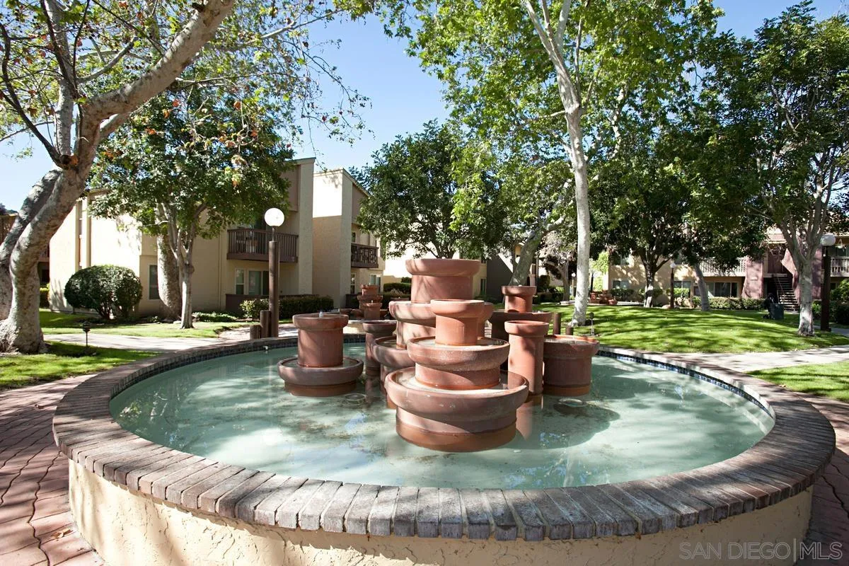 5946 Rancho Mission Road, Unit 160 San Diego, CA 92108 - Photo 29 of 31 a view of a backyard with swimming pool