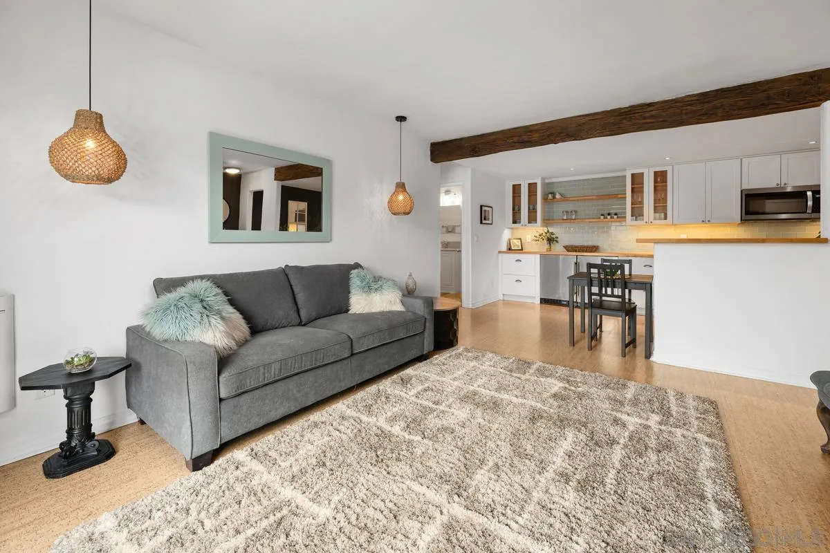 5946 Rancho Mission Road, Unit 160 San Diego, CA 92108 - Photo 4 of 31 a living room with furniture and a table