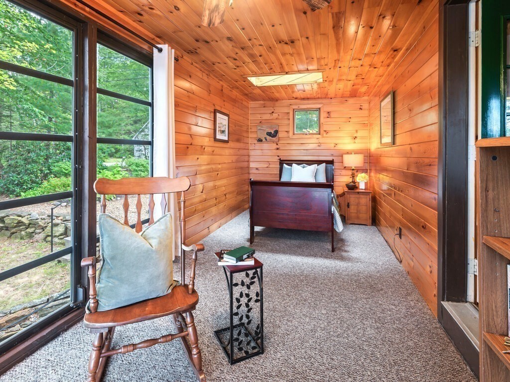 61 Bennetts Road Sturbridge, MA 01566 - Photo 19 of 42 a balcony with chairs and a table