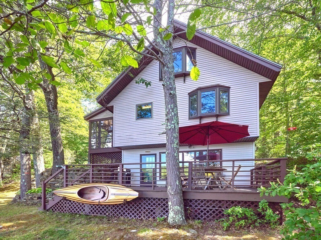 61 Bennetts Road Sturbridge, MA 01566 - Photo 29 of 42 a view of a house with backyard and sitting area
