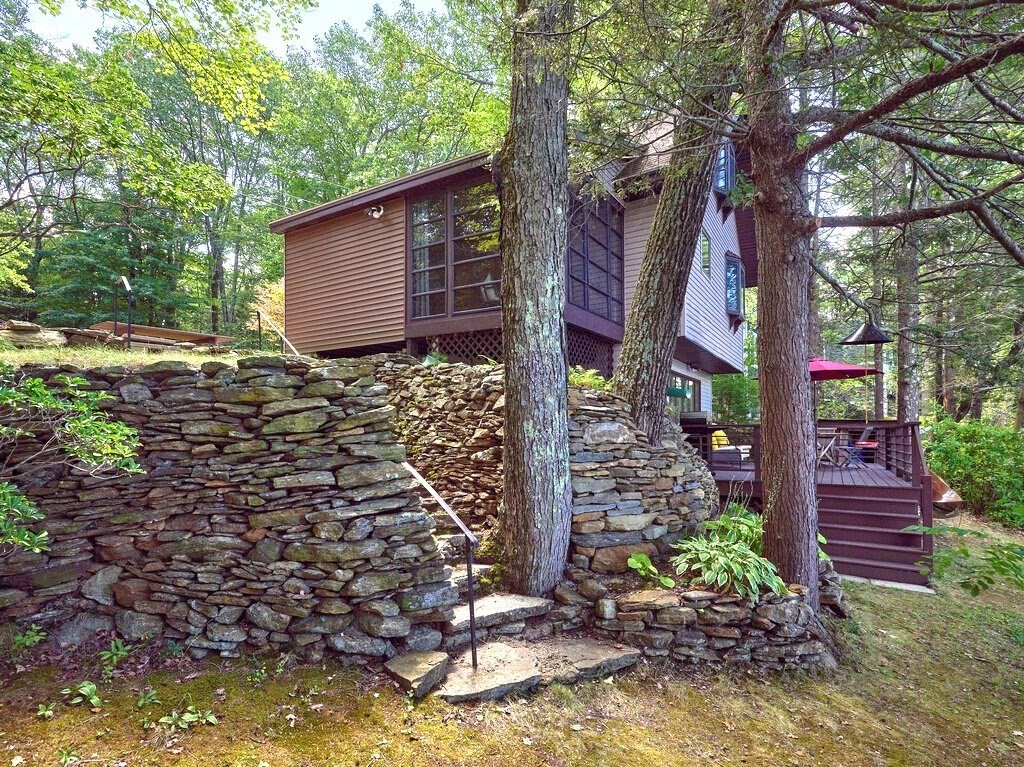 61 Bennetts Road Sturbridge, MA 01566 - Photo 33 of 42 a backyard of a house with lots of green space