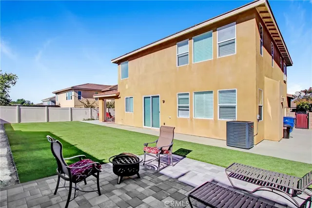 a front view of a house with yard and green space
