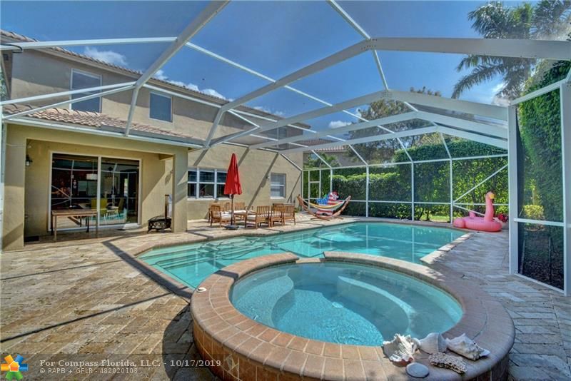 Huge pool with oversized spa. Fully screened will keep the pool clean. Home situated on an oversized pie lot.