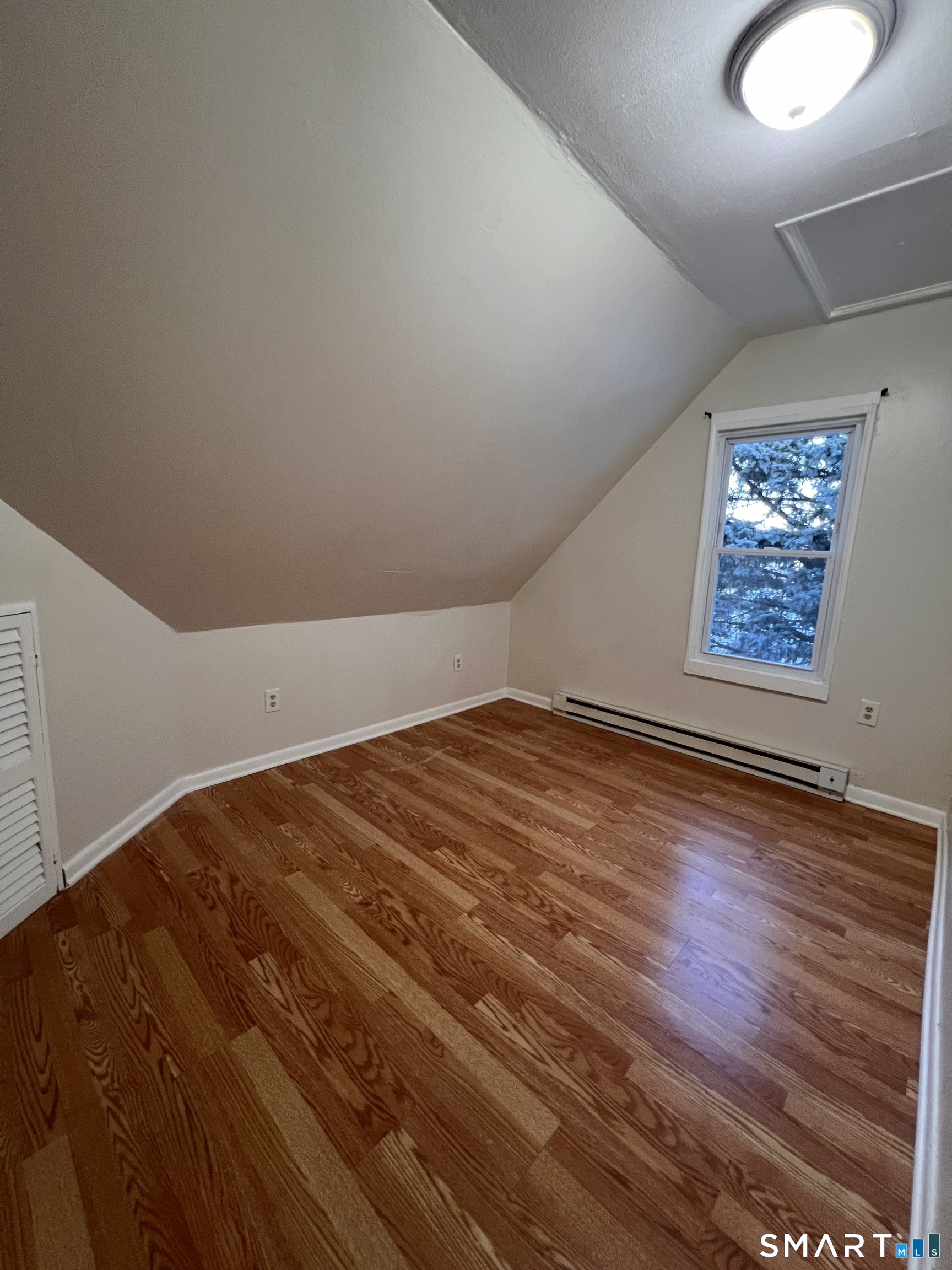 128 Prince Street Bridgeport, CT 06610 - Photo 17 of 19 a view of empty room with wooden floor