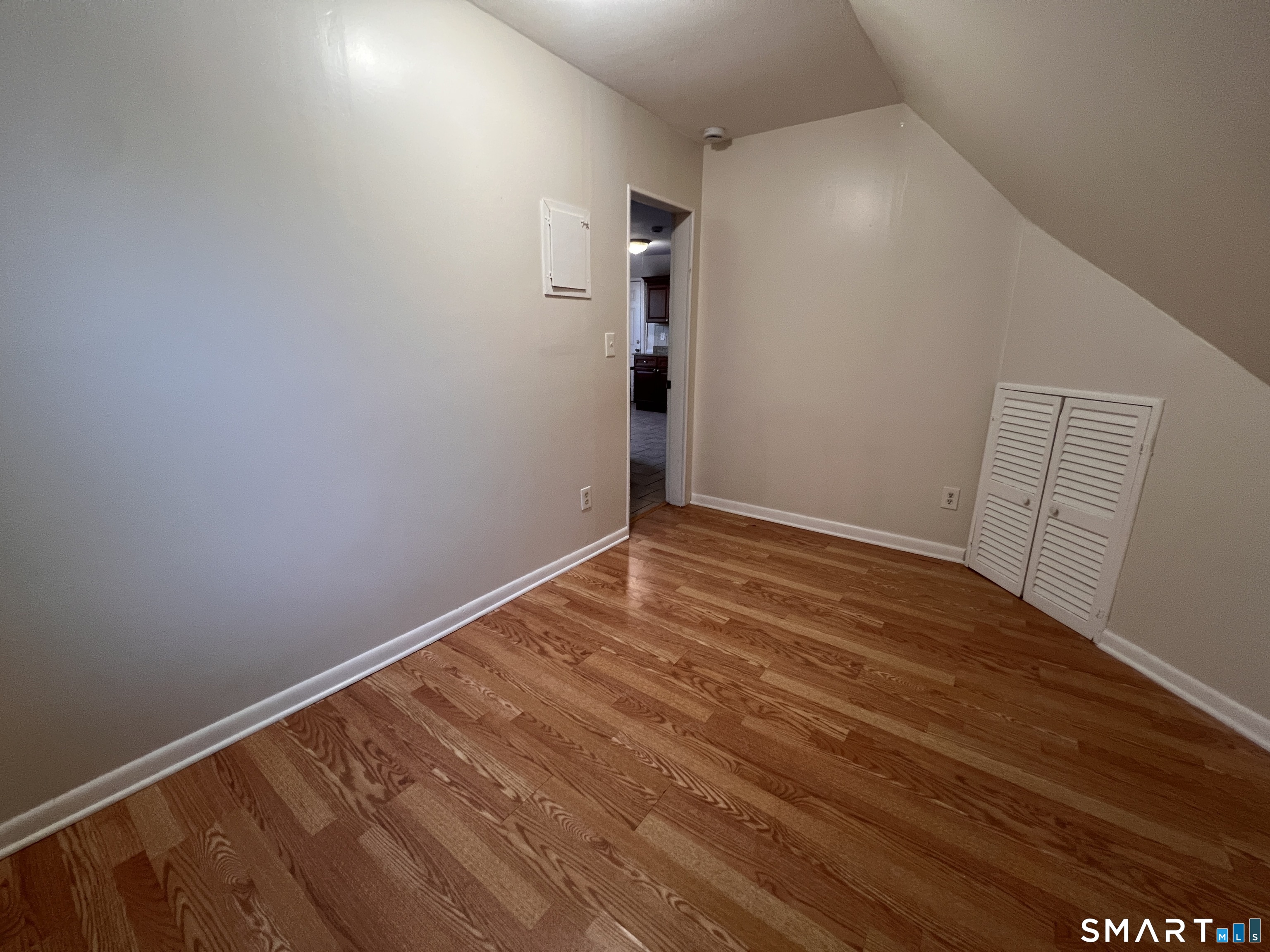128 Prince Street Bridgeport, CT 06610 - Photo 18 of 19 a view of room with wooden floor and stairs