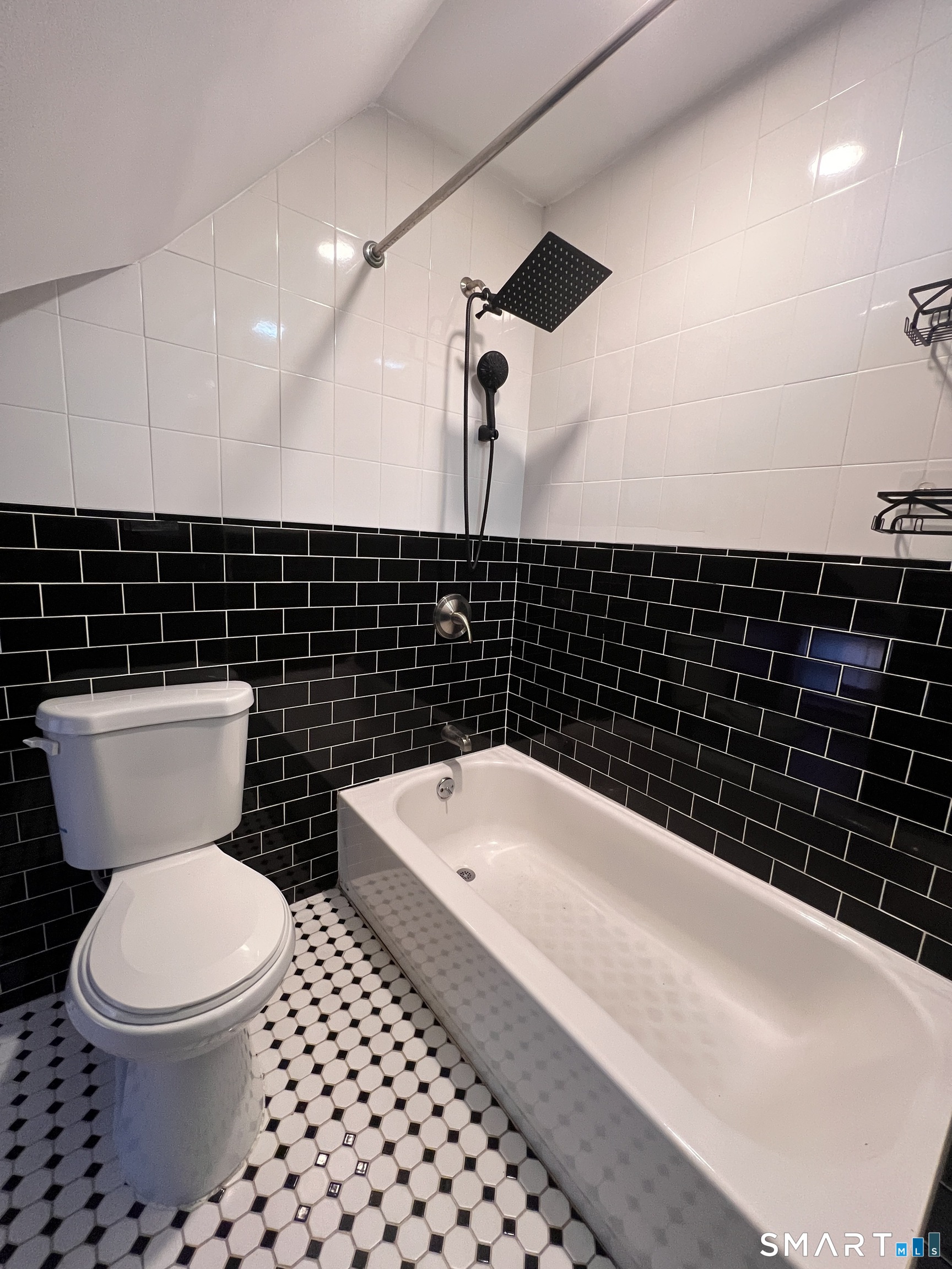 128 Prince Street Bridgeport, CT 06610 - Photo 10 of 19 a bathroom with a toilet a sink and a bathtub