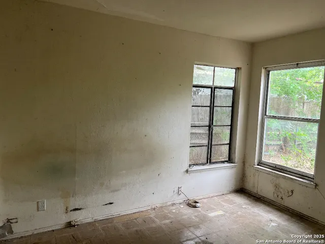 a view of a kitchen with a sink and a refrigerator