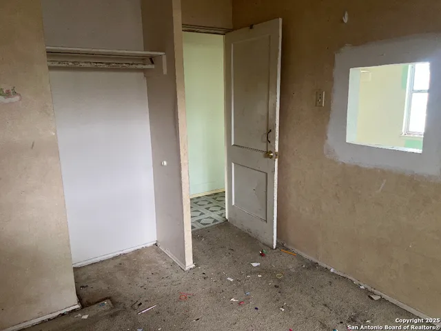 an empty room with a empty space and a window