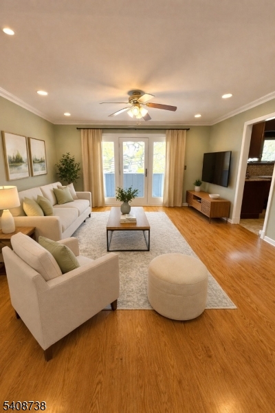 27 Espy Road, Unit A7 Caldwell, NJ 07006 - Photo 3 of 29 a living room with furniture and a flat screen tv