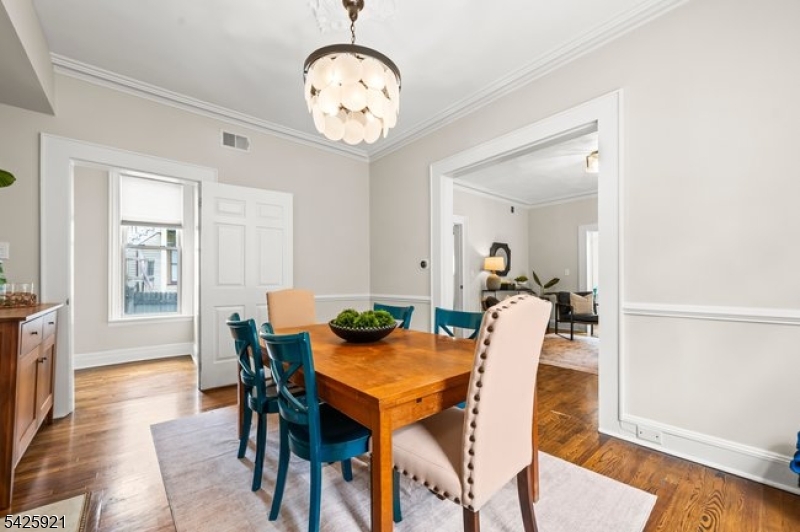 166 Valley Road Montclair, NJ 07042 - Photo 15 of 37 a view of a dining room with furniture and wooden floor