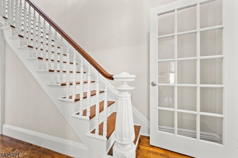 166 Valley Road Montclair, NJ 07042 - Photo 24 of 37 a view of staircase with wooden floor and white walls
